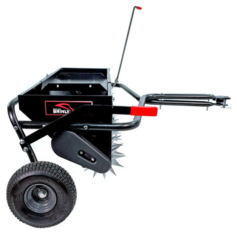 Side view of Tow Behind 2-In-1 Lawn Aerator And Spreader With Weight Tray For Extra Penetration Drops Seed Fertilizer Or Lime