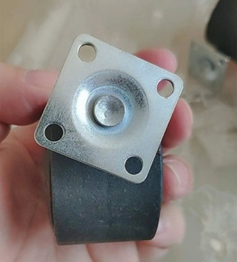 Heavy Duty Twin Wheel Casters 2 Inch Swivel Furniture Plates with smooth rolling rubber tires in hand, showing mounting plate.