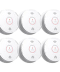 Snag This Six Pack Smoke Detector Set With Ten Year Sealed Battery view showing six white alarms with photoelectric sensors.