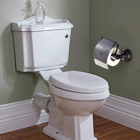 Oil Rubbed Bronze Toilet Paper Holder With Cover, brass tissue roll holder mounted beside white bathroom toilet.