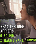 Woman using SM7dB Dynamic Studio Mic with Built In Preamp for podcasting, studio setting with laptop and headphones