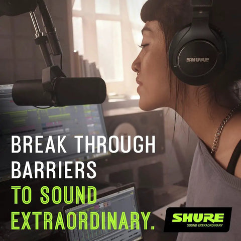 Woman using SM7dB Dynamic Studio Mic with Built In Preamp for podcasting, studio setting with laptop and headphones