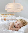 XINGSIYUELYX Ceiling Fan with Light featuring an ultra-quiet motor, shown above a sleeping child, in a cozy setting.