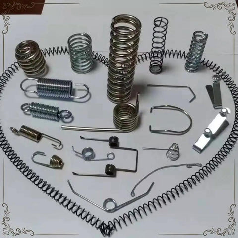 Assorted metal springs including compression, extension, and torsion springs showing diverse shapes and sizes for Rock Solid Six Axis Cnc Wire Spring Machine With Slick Automatic Coiling For Legit Compression Extension And Torsion Spring Fabrication On Your Daily Shop Floor.