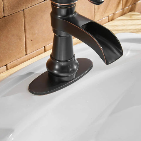 Oil Rubbed Bronze Waterfall Bathroom Sink Faucet With Single Handle 1 Hole Mount No Fuss Easy Install Pop Up Drain Assembly And Durable Supply Hose Farmhouse Vanity Bath Faucet close-up on spout and base.