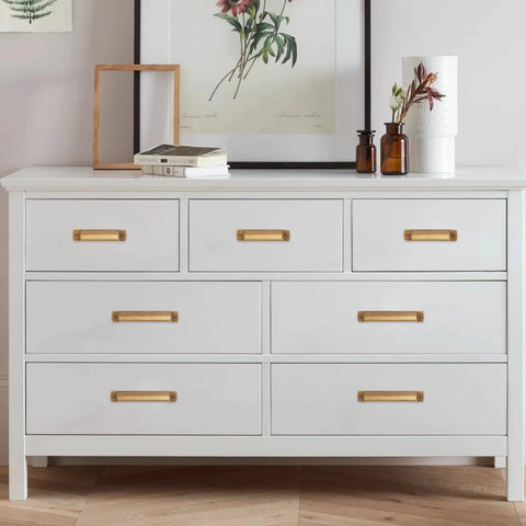 10 Pack 2.5 Inch Antique Brass Cabinet Handles And Cup Pulls Set installed on white dresser drawers