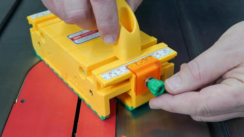 Two Pack 3D Push Block With SafeRip Kit For Table Saws Router Tables Band Saws And Jointers In Yellow And Green Delivers Pro Grade Precision And Control While Cutting And Reducing Kickback For Safer Woodworking showing close-up of adjustment knob in use