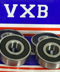 4-Pack 6201-2RS Ball Bearings Rubber Sealed 6201RS chrome steel with double rubber seals on a colored background