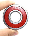 Close-up of Two 6304-2NSE Chrome Steel Deep Groove Ball Bearing, showing red seal