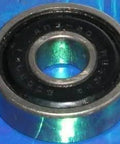638-2RS Sealed Miniature Ball Bearing 8x28x9mm, chrome steel, side view on blue background
