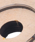 Close-up of 65mm Circular Cutting Die for Leather Cardboard Rubber Plastic Clay, Alloy Steel, on Birch Wood Base