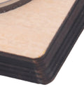 Close-up of 65mm Circular Cutting Die For Leather Cardboard Rubber Plastic Clay And Layered Fabric on birch wood base