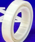 6701 Full Ceramic Bearing 12x18x4mm displayed on a blue background, highlighting its shiny white zirconium oxide construction.