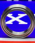 Premium 6703ZZ Thin Slim Bearing 17x23x4mm - Shielded Ball Bearing close-up view on blue background