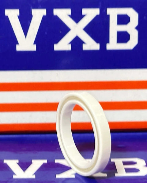 6704 Full Ceramic Bearing 20x27x4mm showcased in front view against a colorful background.