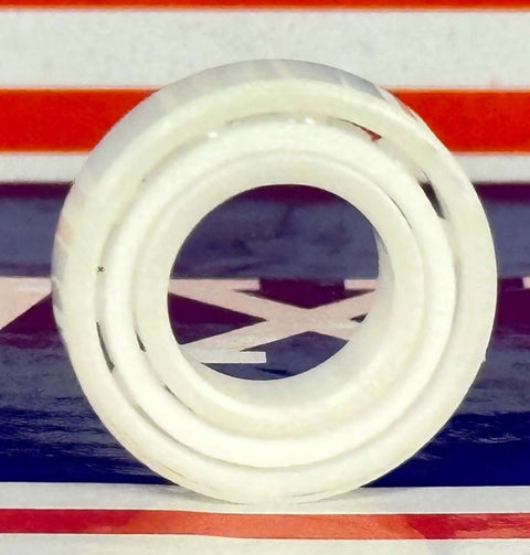 6800 Full Ceramic Ball Bearing 10x19x5mm, front view showing its white Zirconia ceramic design and PTFE cage.