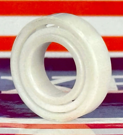 Close-up of 6800 Full Ceramic Ball Bearing 10x19x5mm showcasing its ZrO₂ ceramic material and PTFE cage.