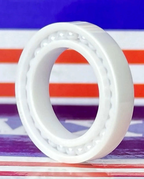 6803 Full Complement Full Ceramic Bearing 17x26x5mm against a colorful background, showcasing its ceramic build.