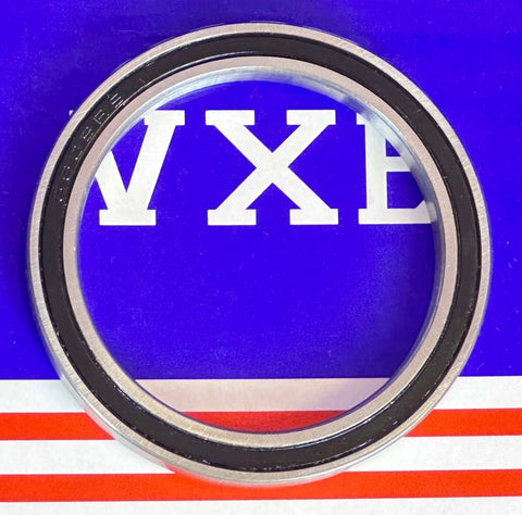 6809-2RS Ball Bearing 45x58x7mm - Sealed, chrome steel with rubber seals, top view on colorful background.