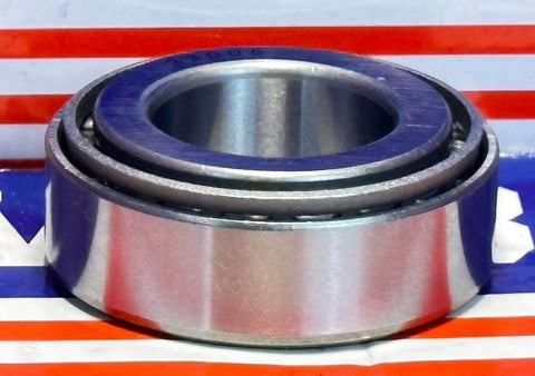 32005X Tapered Roller Bearing 25x47x15mm, chrome steel cone and cup, handles heavy radial and axial loads, displayed on striped backdrop.