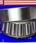 Close-up of 32312 Tapered Roller Wheel Bearing with cone and cup, made from 52100 chrome steel, for radial and axial loads.