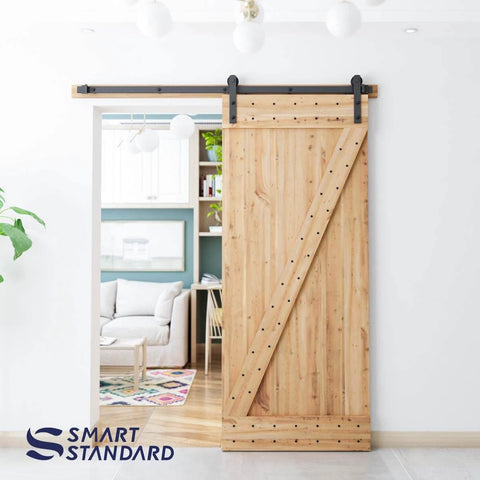 6ft Barn Door Hardware Kit with I shape hanger, installed on wooden barn door, showing heavy duty sliding door track in a modern living room.