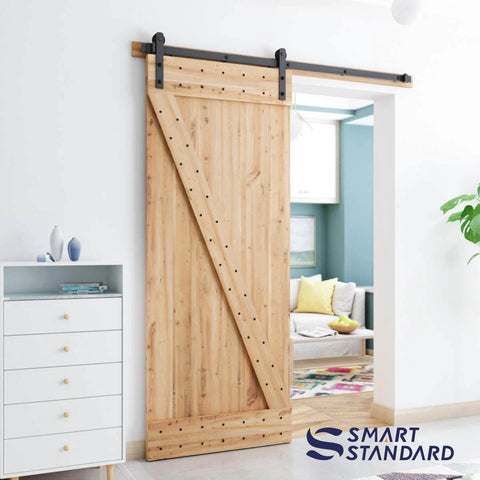 Wooden door with 6ft Barn Door Hardware Kit with I shape hanger, installed in living room, carbon steel track for smooth quiet sliding.