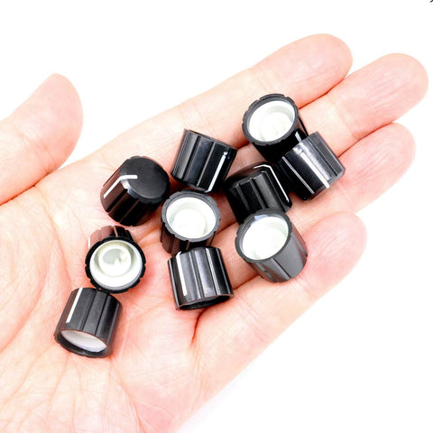 Hand holding 10 Pcs 6mm D Type Potentiometer Knobs For 6 Mm Shaft Dope Volume Tone Rotary Knobs For Encoder Electric Guitar Speaker DJ