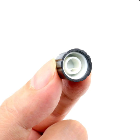 Close-up of 10 Pcs 6mm D Type Potentiometer Knob, black interior view, for encoder electric guitar speaker mixer, 15x13.5mm replacement