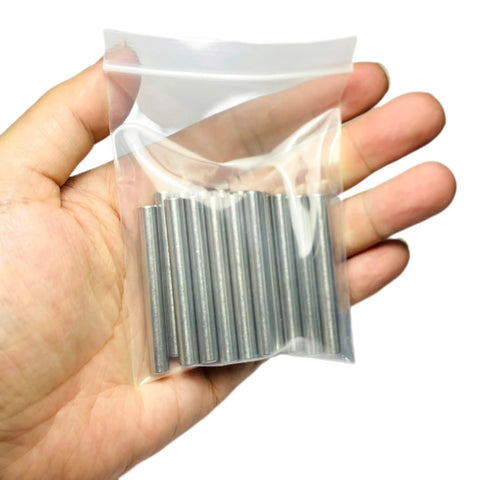 Hand holding a bag of Sturdy 6mm Dowel Pins Set For Shelves And Woodworking 15 Pack 50mm Length 304 Stainless Steel M6 Dowels