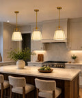 Karjearl Gold Pendant Lights Kitchen Island, 12.2" Linen Drum Chandelier above a modern kitchen island with bar stools.
