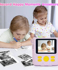 Kids Instant Print Camera Paper Refills 16 Rolls White Thermal Paper For Photo Printer Compatible With ESOXOFFER Dylanto Cimizi Himont Kids Cameras Each Roll About 236 Inches Long Prints 75 To 90 Photos beside kids using a print camera