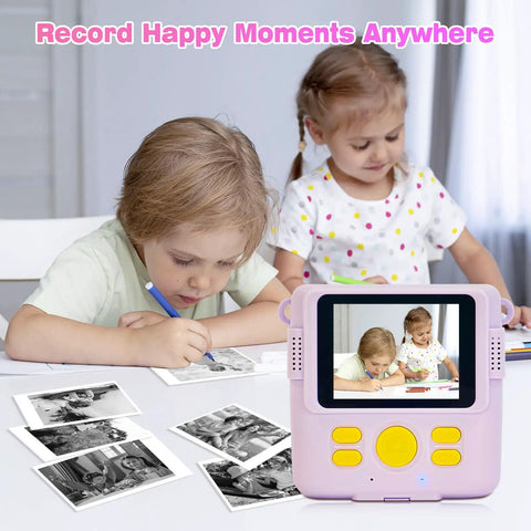 Kids Instant Print Camera Paper Refills 16 Rolls White Thermal Paper For Photo Printer Compatible With ESOXOFFER Dylanto Cimizi Himont Kids Cameras Each Roll About 236 Inches Long Prints 75 To 90 Photos beside kids using a print camera