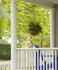 Size 2/0 Diameter 100-Foot Zinc Plated Tie Out Chain for Hanging Garden Baskets on a porch with greenery