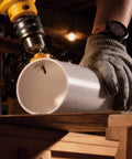 KATA 3-piece impact hole saw set mounted on a yellow drill cutting a white PVC pipe