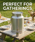 Tough As Nails Heavy Duty Stainless Steel Water Dispenser Milk Can Jug With Secure Locking Airtight Lid For Outdoors Hunting Trips Ranch Work Roadside Stops And Weekend Adventures on a picnic table.
