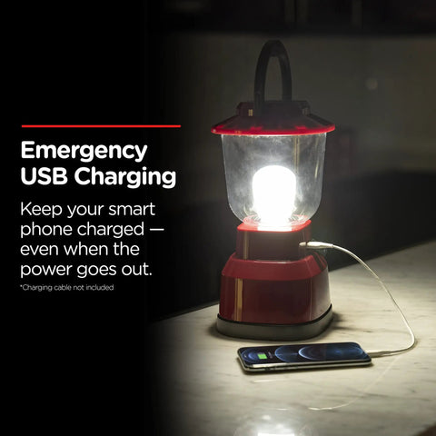 Beefy 800 Lumen LED Camping Lantern With USB Rechargeable Battery illuminating beside a smartphone on a counter.
