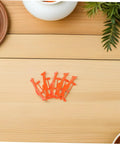 Five Pack Rubber Band Powered Glider Plane Kit For Kids And Fam brackets, orange on wooden table, DIY assembly parts view