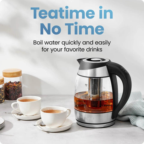 Electric Kettle With Temperature Control And Removable Infuser, Glass 1.8L, on a counter with teacups and loose tea jars.