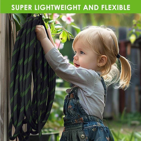 Side view of black garden hose with green stripes coiled on a wall mount.