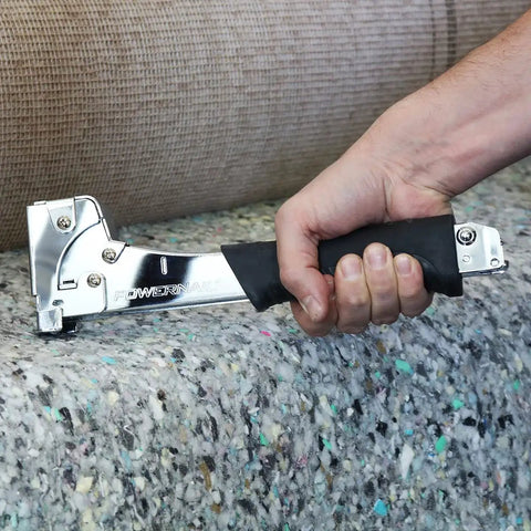 Person using Heavy Duty Hammer Tacker Stapler for 20 Gauge 1/2 Inch Crown with Quick Jam Release in construction project.