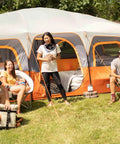 Group enjoying outdoors with Spacious 12 Person Cabin Tent for Family Camping with Multiple Rooms Carry Bag Weather Resistant Design