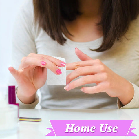 Person using Lint Free Nail Wipes And Gel Polish Remover Pads Set With Cuticle Pushers for manicure at home.