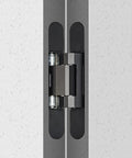 Close-up of Three Pack Heavy Duty Solid Brass Invisible Hydraulic Door Hinges that Soft Close Like Butter installed in a door.