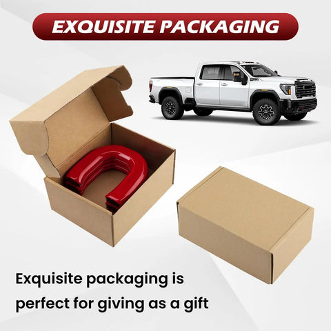 Red Tow Hook Covers for GMC Sierra HD 2500 And 3500 2019 Through 2026 in open packaging next to a white truck.