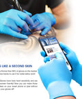 Heavy Duty Disposable Nitrile Gloves Large Size 4 Mil Thick 200 Pack Powder And Latex Free Food Safe Industrial Work Gloves worn during tattoo work.