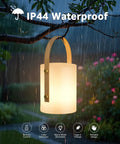 Cordless LED Lantern Table Lamp with Remote hanging in rain, IP44 shower safe and waterproof, ideal for patio and camping vibe