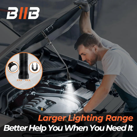 Mechanic uses LED magnetic pickup tool under car hood with flashlight