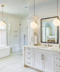 Mid Century Modern 1 Light Globe Pendant Chandelier In Brushed Gold With White Glass Ball in a bright bathroom setting
