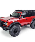Heavy Duty Aluminum Roof And Luggage Rack Compatible With 1/10 Scale Rc Crawler Trx4 Bronco on red truck with large tires